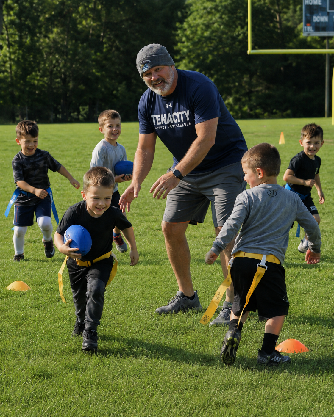Coach Rob Erickson leading young Tenacity athletes through flag football movement games