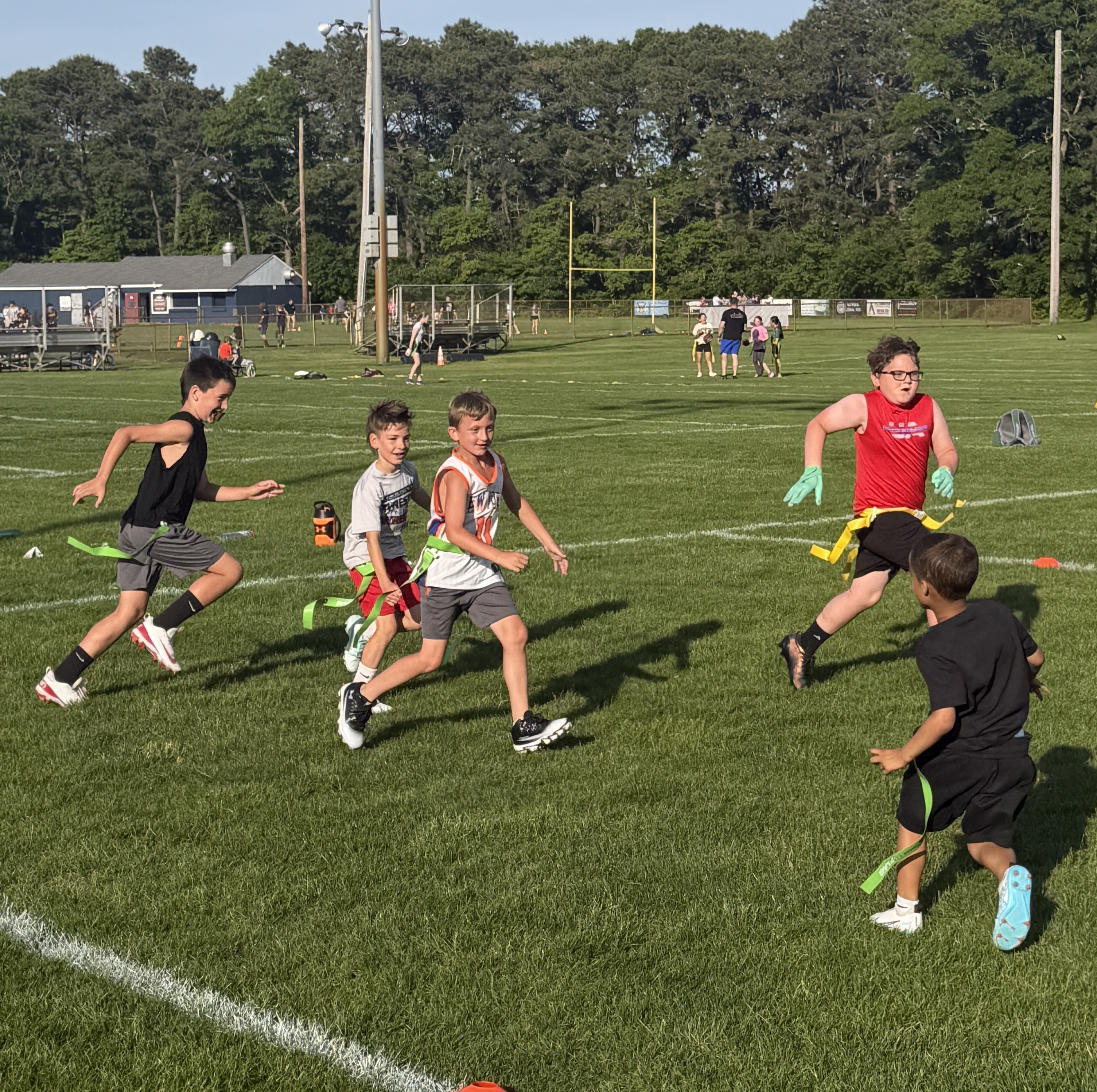 Homeschool PE students playing flag football with Tenacity Sports Performance